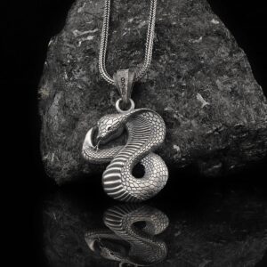 snake necklace is a sterling silver pendant that shaped as a cobra