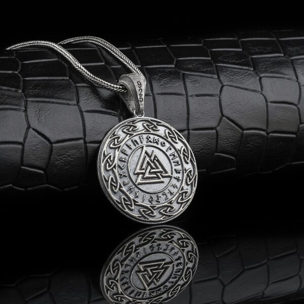 valknut necklace is a round sterling silver jewelry piece that has three triangle at the center of the pendant. it represents ancient celt and germanic peoples mythological beliefs