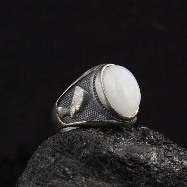 nefertiti ring is a moonstone ring with queen nefertiti ornaments at he bands