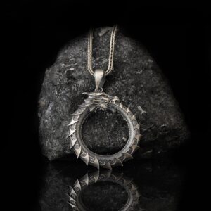 The Ouroboros Necklace Silver 925 is a product of high class craftsmanship and intricate designing. It's solid structure makes it a perfect piece to use as an everyday jewelry to elevate your style.