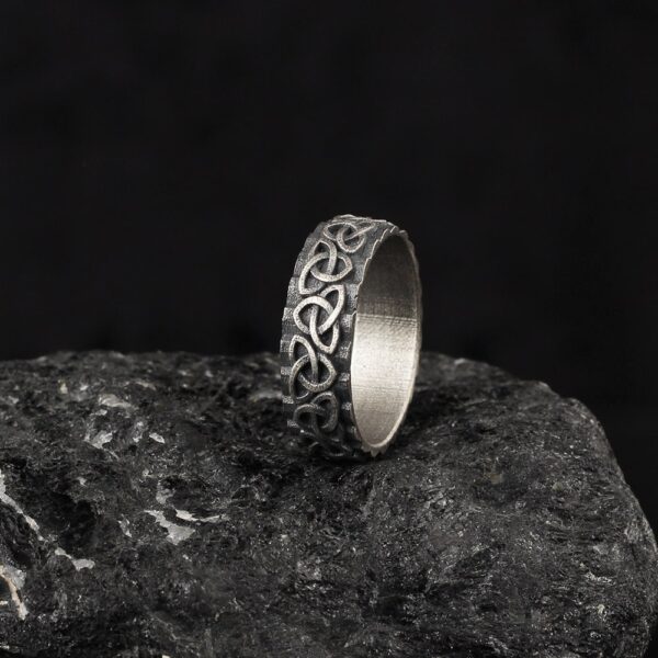 the trinity knot wedding band is a product of high class craftsmanship and intricate designing. it's solid structure makes it a perfect piece to use as an everyday jewelry to elevate your style. espada silver