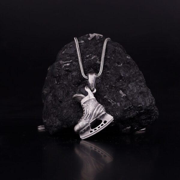skating boot necklace is sterling silver jewelry that tributes skaters and ice sports lovers