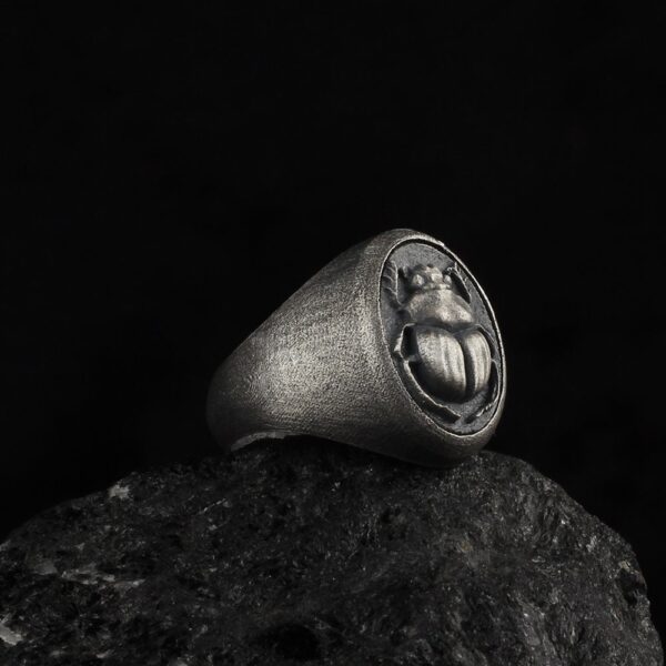 the scarab ring is a sterling silver jewelry that represents the nature and flowers.