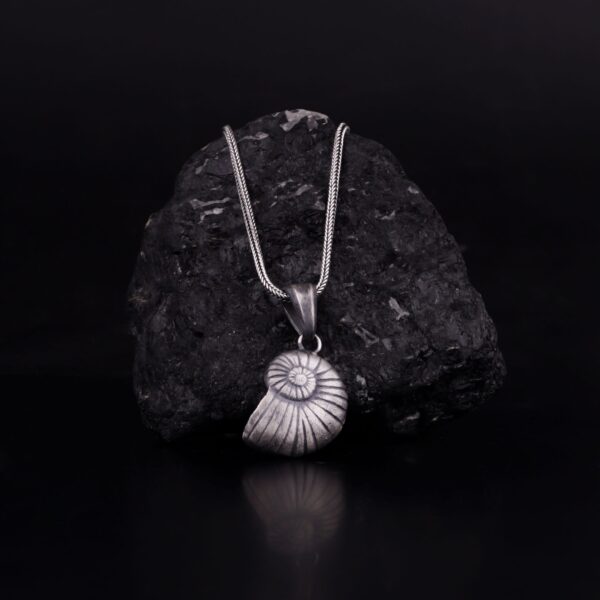 snail shell necklace is a product of sterling silver. it is inspired by wast oceans and seas