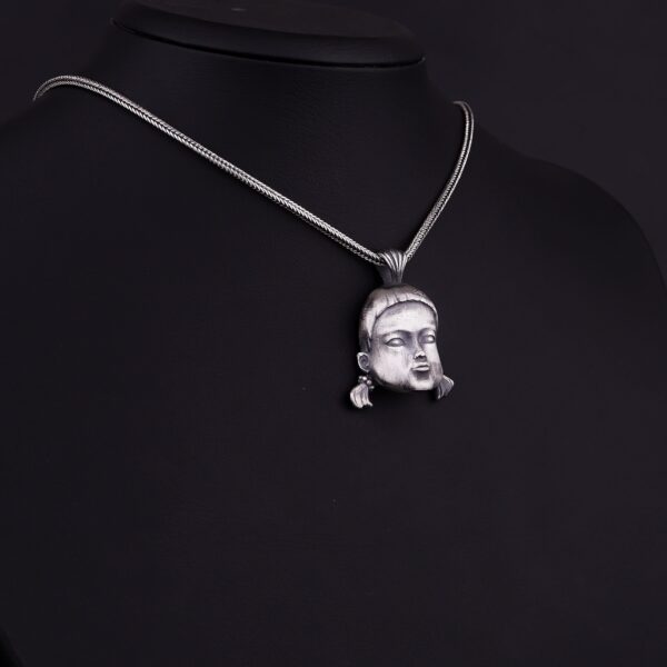 the squid game doll necklace is a product of high class craftsmanship and intricate designing. it's solid structure makes it a perfect piece to use as an everyday jewelry to elevate your style. espada silver