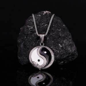 Yin and yang represent duality, or the idea that two opposite characteristics can actually exist in harmony and complement each other. Yin Yang Dragon necklace can convey meanings of peace, balance, love. When worn, Yin represents femininity, passivity, submission, or coldness, whereas Yang represents masculinity, light, positivity, and movement. It is also a way of bringing harmony and balance in life. The Yin Yang Necklace is a product of high class craftsmanship and intricate designing. It's solid structure makes it a perfect piece to use as an everyday jewelry to elevate your style. This exceptional necklace is made to last and worthy of passing onto next generations.