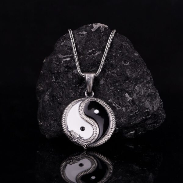 yin and yang represent duality, or the idea that two opposite characteristics can actually exist in harmony and complement each other. yin yang dragon necklace can convey meanings of peace, balance, love. when worn, yin represents femininity, passivity, submission, or coldness, whereas yang represents masculinity, light, positivity, and movement. it is also a way of bringing harmony and balance in life. the yin yang necklace is a product of high class craftsmanship and intricate designing. it's solid structure makes it a perfect piece to use as an everyday jewelry to elevate your style. this exceptional necklace is made to last and worthy of passing onto next generations.