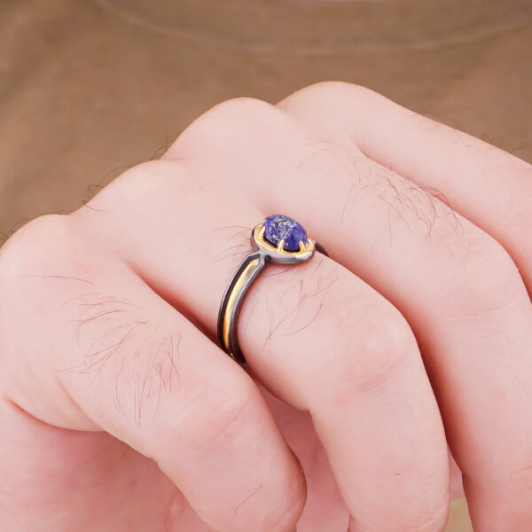 a man wearing rings of the men