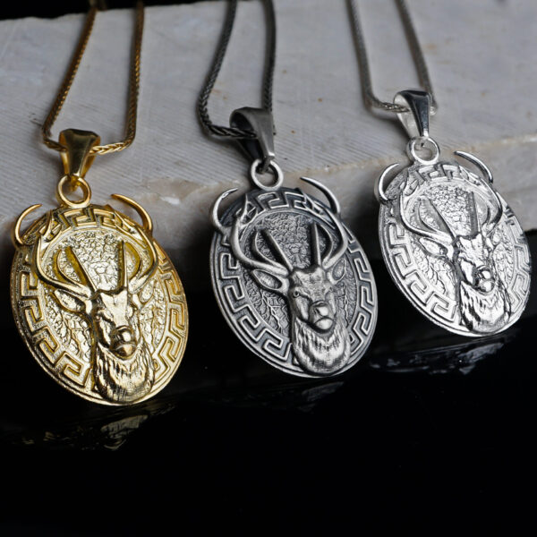 three white stag necklace. one of them is gold plated, the other one is oxidized and the last one is polished sterling silver.