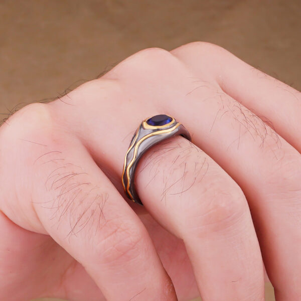 a man wearing sterling silver lord elrond ring